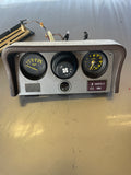 Brown early clock and oil pressure gauge