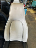Light gray, tan, driver or passenger seat top