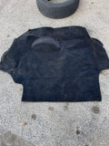 Black rear hatch carpet for a cabriolet convertible.