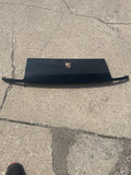 Black header panel with emblem