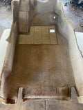Drivers side grey tan footwell carpet