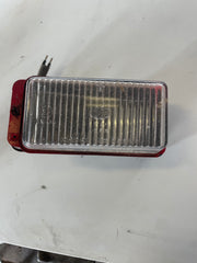 Porsche 944N a passenger side fog light. Free red overspray.