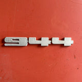 Silver Porsche 944 rear emblem