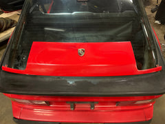 Red Porsche NA header panel with emblem