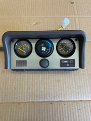 Black early guage cluster with clock and oil